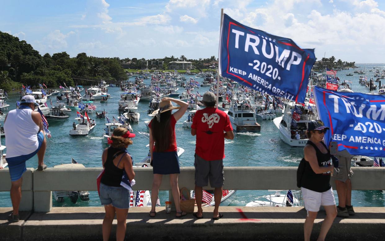  Donald Trump Jr joined supporters of his father at a rally off the coast of Mar-a-Lago  (Getty)