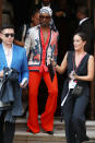 Billy Porter arrived wearing a pair of statement red trousers and a patterned shirt [Photo: Getty]