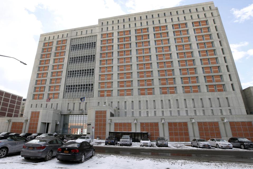 FILE- This Jan. 8, 2017 file photo shows the Metropolitan Detention Center (MDC) in the Brooklyn borough of New York. The Bureau of Prisons confirmed Ghislaine Maxwell, longtime confidante of Jeffrey Epstein, was transferred to the facility Monday, July 6, 2020, after being arrested the preceding Thursday in New Hampshire. She faces charges she helped Epstein recruit women to sexually abuse. (AP Photo/Kathy Willens, File)