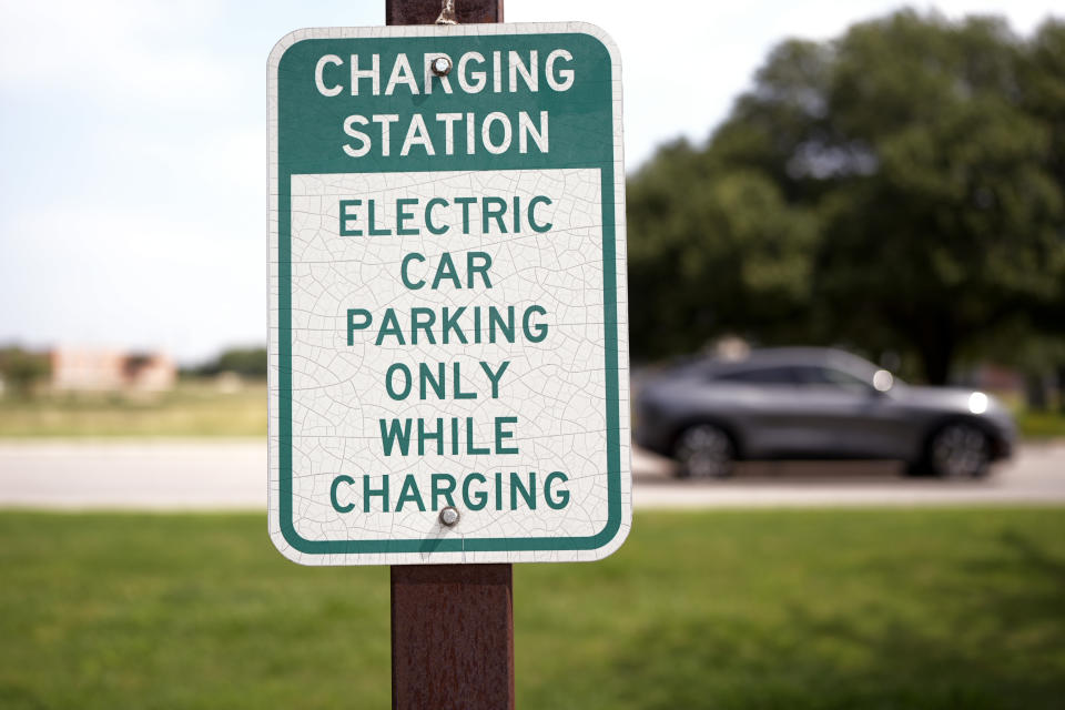 Jose Valdez, 45, who owns three EVs, leaves a charging station in his Mustang Mach-E, Thursday, May 9, 2024, in San Antonio. Many Americans still aren’t sold on going electric for their next car purchase. High prices and a lack of easy-to-find charging stations are major sticking points, a new poll shows. Valdez owns three EVs, including a new Mustang Mach-E. With a tax credit and other incentives, the sleek new car cost about $49,000, Valdez said. He thinks it's well worth the money. (AP Photo/Eric Gay)