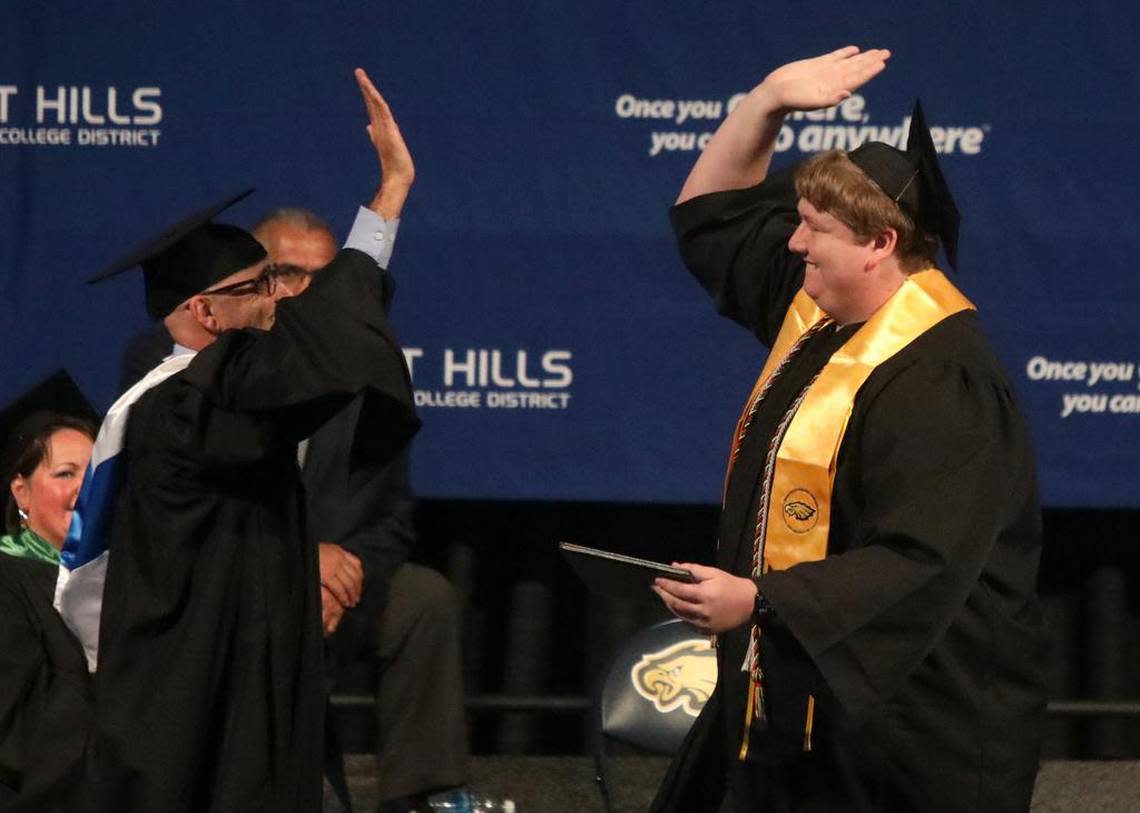 West Hills College Lemoore President James Preston congratulates Logan Dakota Byrum during May 25, 2023 commencement at Golden Eagle Arena.