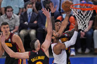 New York Knicks' Derrick Rose, second from right, makes a basket during the first half of Game 1 of an NBA basketball first-round playoff series against the Atlanta Hawks, Sunday, May 23, 2021, in New York. (AP Photo/Seth Wenig, Pool)