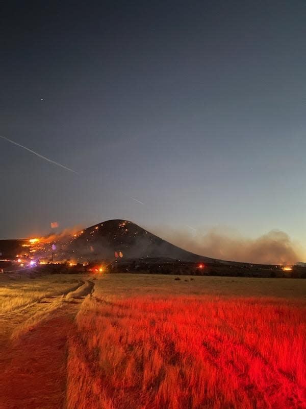 A wildfire burned over the cinder cone known as the Veyo Volcano south of Dammeron Valley late Sunday.