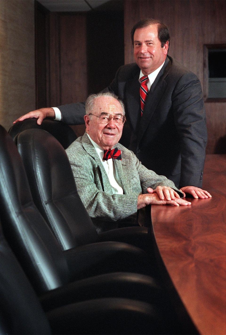 John Ruan, left, poses for a photo with his son, John Ruan III, on Sept. 12, 1998, after naming Ruan III chairman of Ruan Transportation Management Systems.