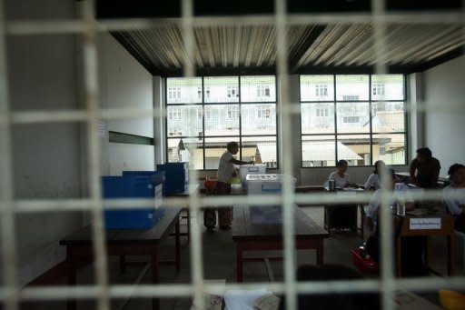 A woman cast her vote during parliamentary by-elections at a polling station in Yangon on April 1. Pollsters face numerous hurdles, including a lack of basic recent data about the Myanmar population that hampers reliability