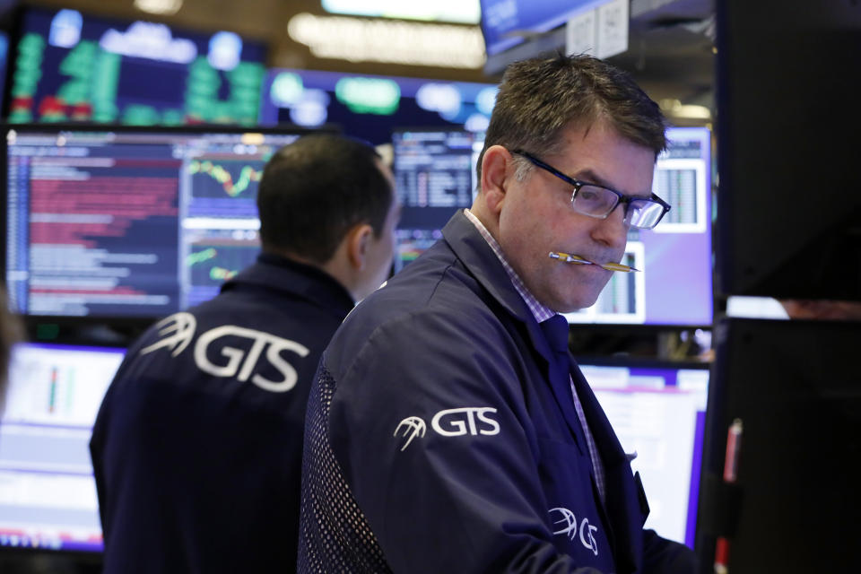 FILE - In this Jan. 9, 2020, file photo specialist David Haubner works on the floor of the New York Stock Exchange. The U.S. stock market opens at 9:30 a.m. EST on Thursday, Jan. 30. (AP Photo/Richard Drew, File)