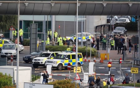 Police officers are seen as a suspect package was found at Manchester Airport