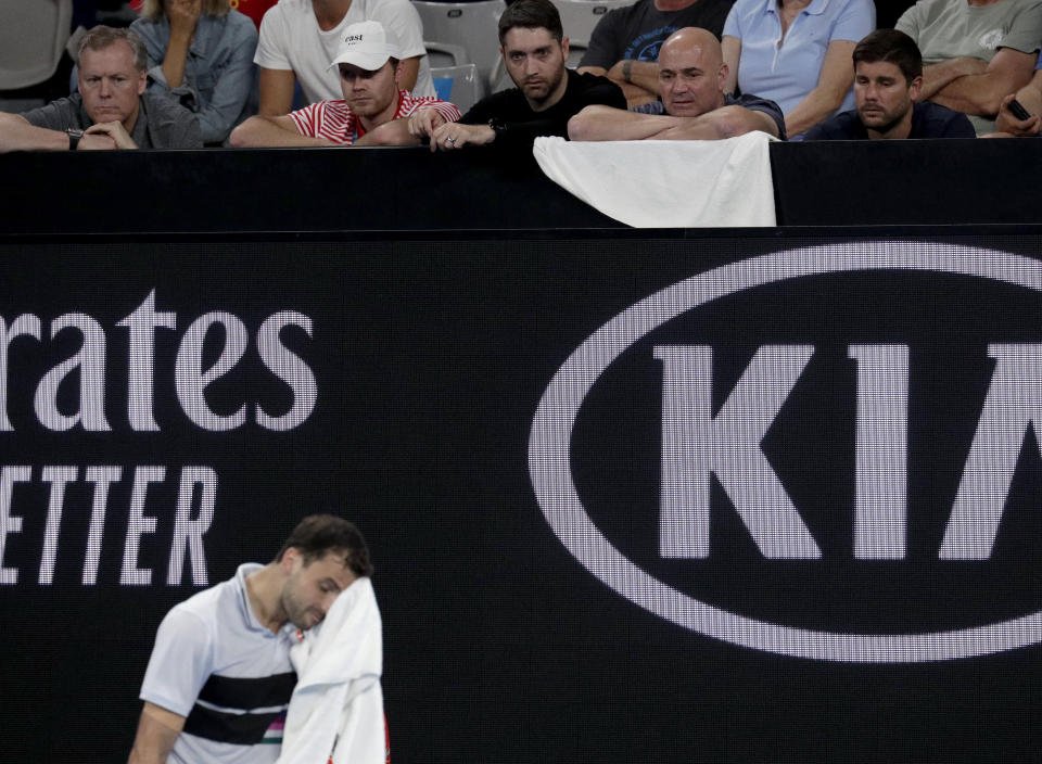 Andre Agassi, coach of Bulgaria's Grigor Dimitrov watches his third round match against Italy's Thomas Fabbiano at the Australian Open tennis championships in Melbourne, Australia, Friday, Jan. 18, 2019. (AP Photo/Aaron Favila)