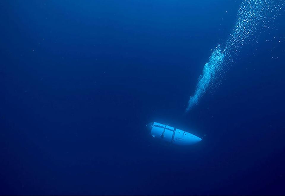 This undated image courtesy of OceanGate Expeditions, shows their Titan submersible during a descent. Rescue teams expanded their search underwater on June 20, 2023, as they raced against time to find a Titan deep-diving tourist submersible that went missing near the wreck of the Titanic with five people on board and limited oxygen. All communication was lost with the 21-foot (6.5-meter) Titan craft during a descent June 18 to the Titanic, which sits at a depth of crushing pressure more than two miles (nearly four kilometers) below the surface of the North Atlantic.