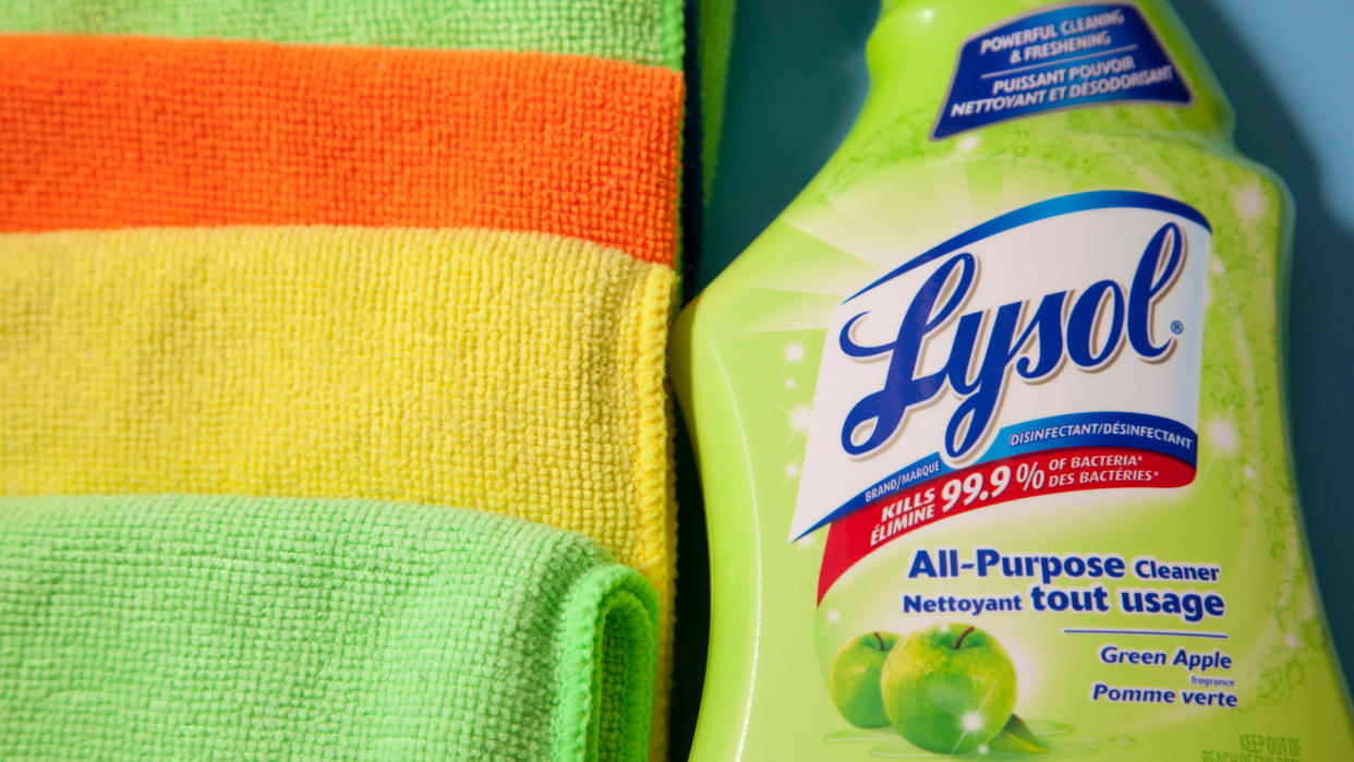 Halifax, Canada- June 1, 2019: Close up of Lysol cleaning spray and yellow, orange cleaning rags.