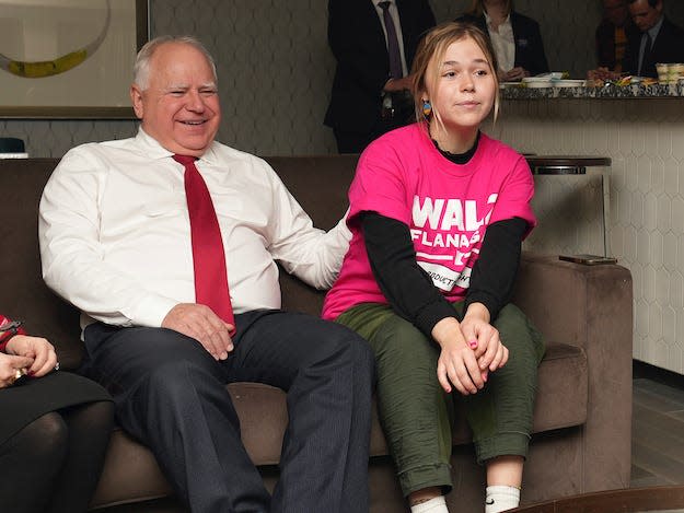 Minnesota Gov. Tim Walz, second from left, watches election results with his wife, Gwen, left, and daughter, Hope, center right, Tuesday, Nov. 8, 2022