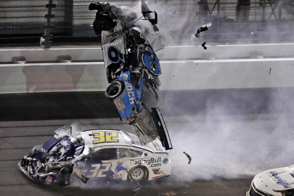 FILE - In this Monday, Feb. 17, 2020, file photo, Ryan Newman (6) goes airborne after crashing into Corey LaJoie (32) during the NASCAR Daytona 500 auto race at Daytona International Speedway in Daytona Beach, Fla. Newman, who suffered a head injury in the season opening Daytona 500, will race Sunday, May 17 when NASCAR resumes its season at Darlington Raceway. (AP Photo/Chris O'Meara, File)