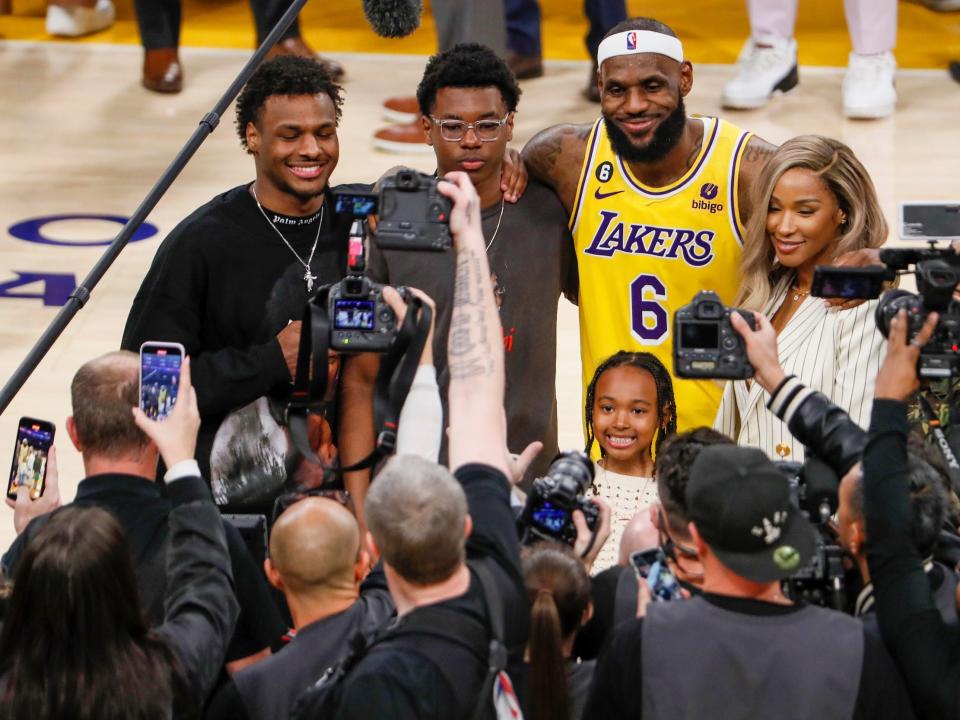 LeBron James (center) with his wife and three children.