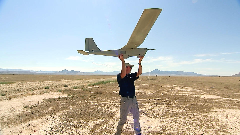 IMAGE: An AeroVironment operator prepares to launch the Puma surveillance drone. (NBC News)