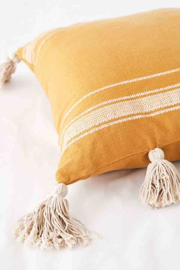 <strong><a href="https://www.urbanoutfitters.com/shop/ivy-fringe-striped-throw-pillow?category=apartment-room-decor&amp;color=070" target="_blank" rel="noopener noreferrer">Get it at Urban Outfitters</a></strong>, $39.