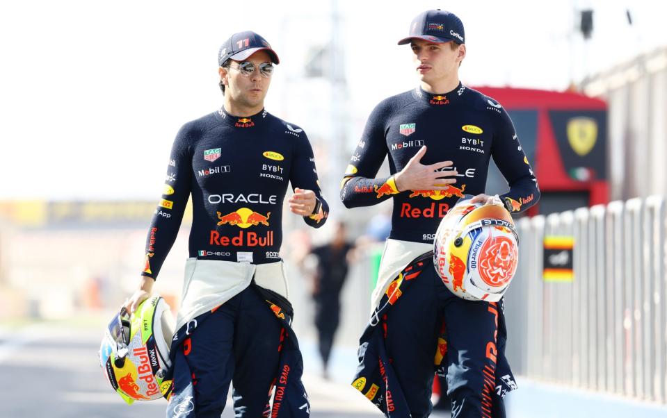 Sergio Perez of Mexico and Oracle Red Bull Racing and Max Verstappen of the Netherlands and Oracle Red Bull Racing talk during day one of F1 Testing at Bahrain International Circuit - F1 2023 season predictions: from drivers' title to the first bust up - Mark Thompson/Getty Images