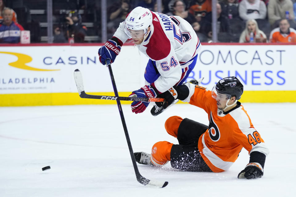 Montreal Canadiens' Jordan Harris (54) collides with Philadelphia Flyers' Morgan Frost (48) during the second period of an NHL hockey game, Tuesday, March 28, 2023, in Philadelphia. (AP Photo/Matt Slocum)