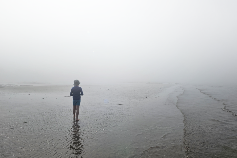 Boy in mist at beach