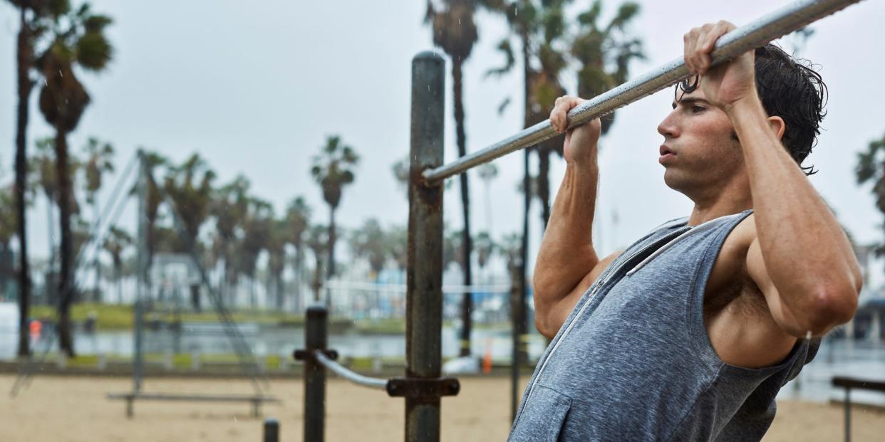 Man exercising pull ups