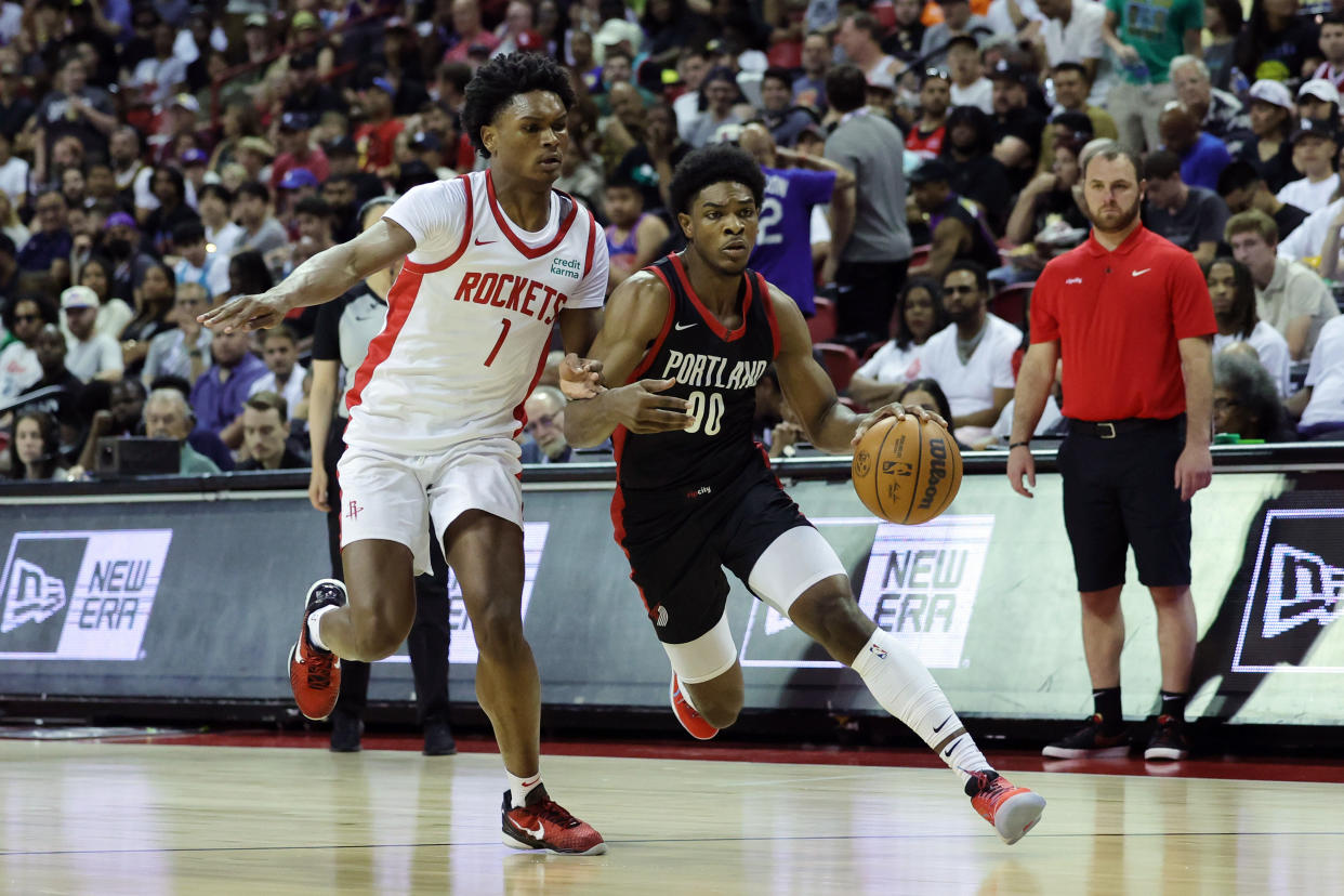 LAS VEGAS, NEVADA - JULY 07: Scoot Henderson #00 of the Portland Trail Blazers dribbles the ball against Amen Thompson #1 of the Houston Rockets during the third quarter at the Thomas & Mack Center on July 07, 2023 in Las Vegas, Nevada. (Photo by Ethan Miller/Getty Images)