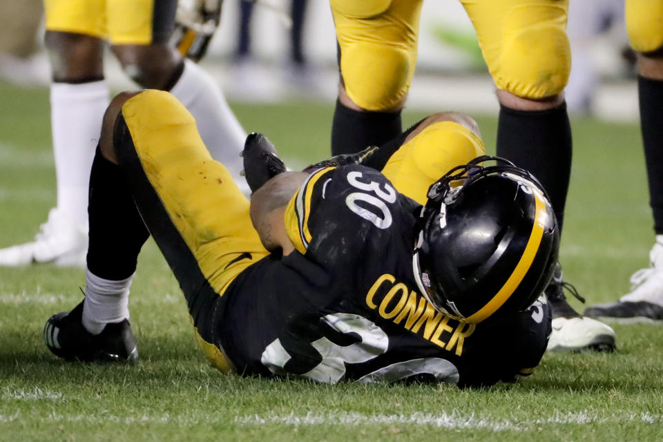 Pittsburgh Steelers running back James Conner (30) is injured after being tackled by Los Angeles Chargers defensive back Adrian Phillips in the second half of an NFL football game, Sunday, Dec. 2, 2018, in Pittsburgh. (AP Photo/Gene J. Puskar)