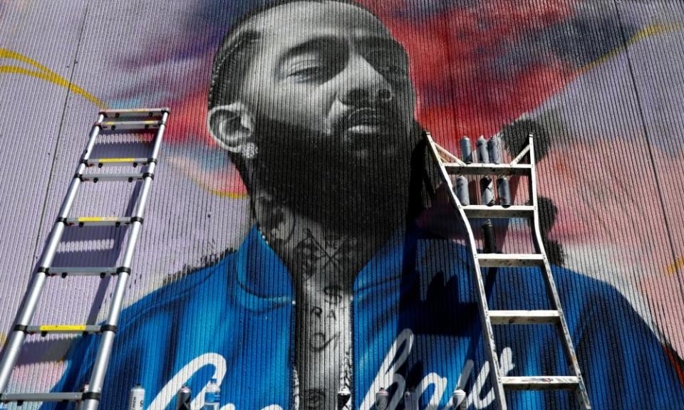 A mural commemorates the musician Nipsey Hussle outside of his Marathon Clothing store in Los Angeles, California.