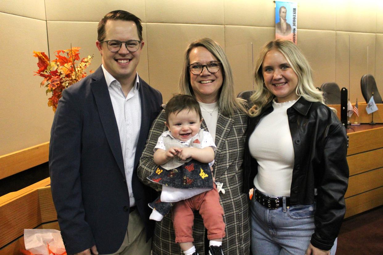 Nicholas and Julie Jacobs with their 21-year-old daughter, Tatum Scott, celebrate the adoption of six-month-old Asher James Jacobs.