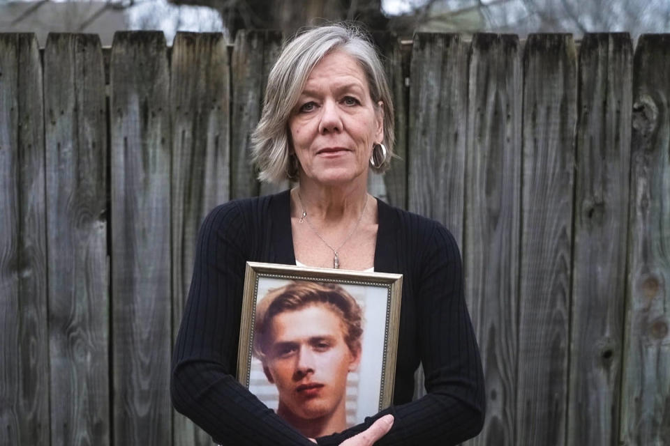 Kristen Gilliland holds a photo of her son Anders.  Anders died of an accidental overdose after being diagnosed with schizophrenia caused by marijuana-induced psychosis.  (NBC News)