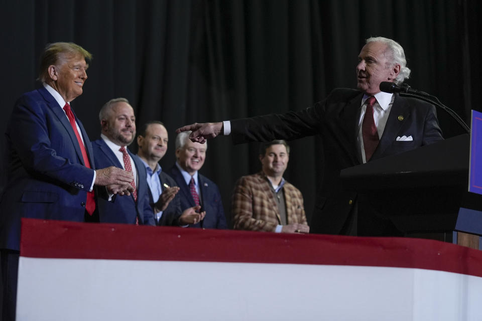South Carolina Gov Henry McMaster, right, pointing towards Republican presidential candidate former President Donald Trump, left, during a campaign event in Manchester, N.H., Saturday, Jan. 20, 2024. (AP Photo/Matt Rourke)