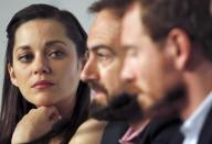 (L-R) Cast member Marion Cotillard, director Justin Kurzel and cast member Michael Fassbender attend a news conference for the film "Macbeth" in competition at the 68th Cannes Film Festival in Cannes, southern France, May 23, 2015. REUTERS/Regis Duvignau