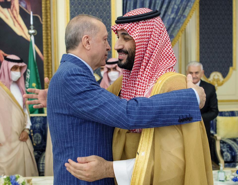 FILE - In this photo released by the Saudi Royal Palace, Turkish President Recep Tayyip Erdogan, left, hugs Saudi Arabia's Crown Prince Mohammed bin Salman before a meeting in Jiddah, Saudi Arabia, April 28, 2022. In the years since Saudi Crown Prince Mohammed bin Salman catapulted to power, it has been hard to find a controversy in the Middle East that doesn't somehow involve the 37-year-old heir to the throne. Now he's pivoting to his next audacious plan: Giving peace a chance. (Bandar Aljaloud/Saudi Royal Palace via AP, File)