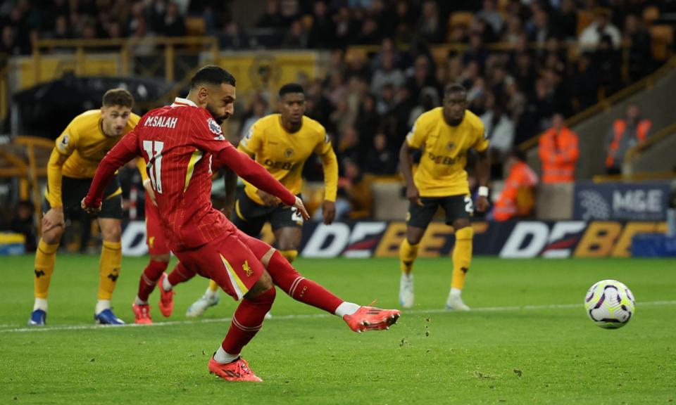 <span>Mohamed Salah scores Liverpool’s winner against Wolves from the penalty spot.</span><span>Photograph: Phil Noble/Reuters</span>