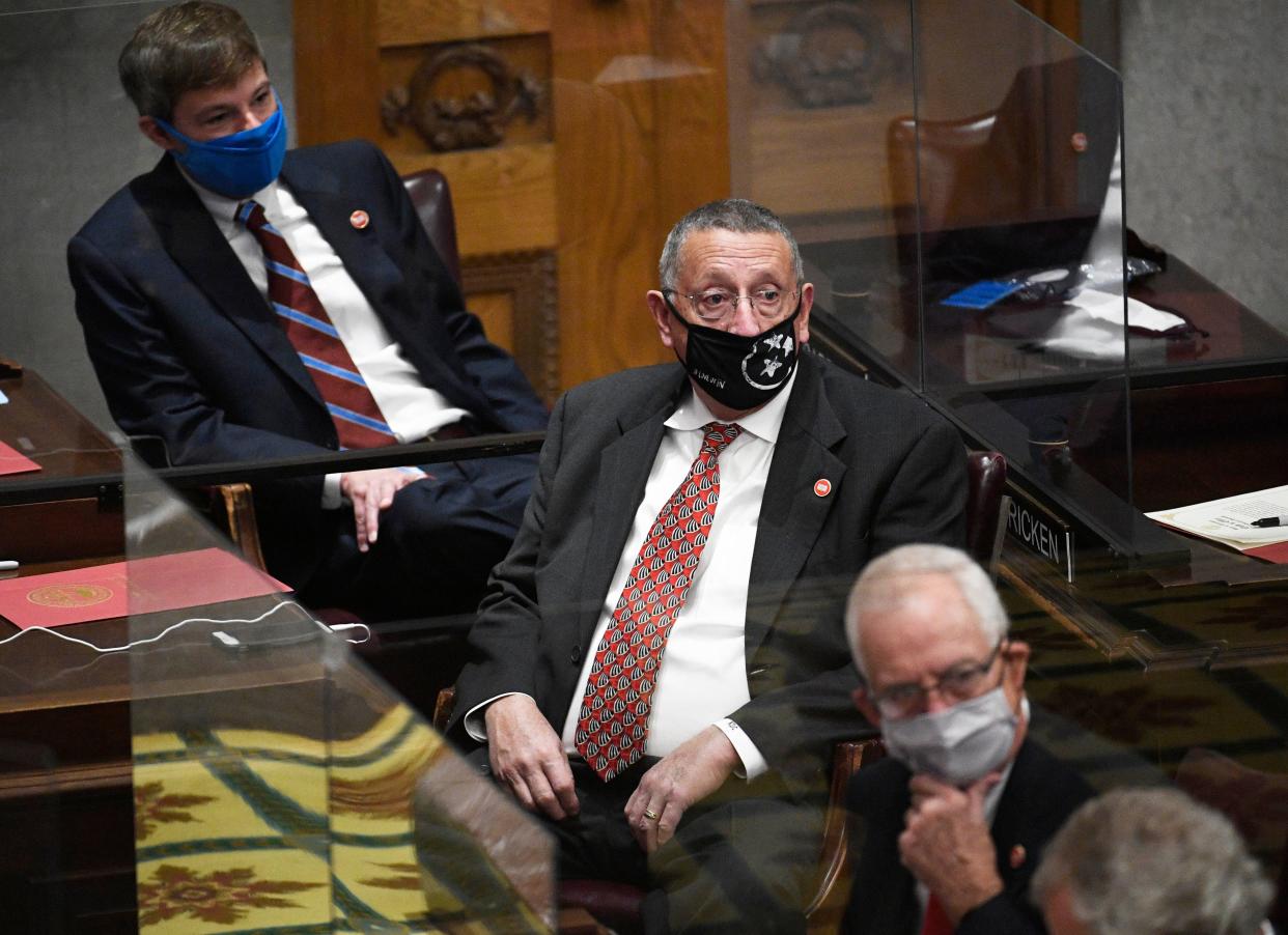 Rep. Kent Calfee, R-Kingston, center, sits in the House chamber during the start of the 112 Tennessee General Assembly in Nashville, Tenn., Tuesday, Jan. 12, 2021.