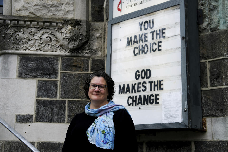 Beth Stroud stands for a portrait outside Turning Point United Methodist Church in Trenton, N.J., on Sunday, May 12, 2024. Stroud was defrocked from her job as a United Methodist pastor in Philadelphia 20 years ago. In a church trial, she was found guilty of violating Christian teaching because she acknowledged living in a committed relationship with another woman. Earlier this month, delegates at a United Methodist conference struck down longstanding anti-LGBTQ bans and created a path for clergy ousted because of them to seek reinstatement. (AP Photo/Luis Andres Henao)