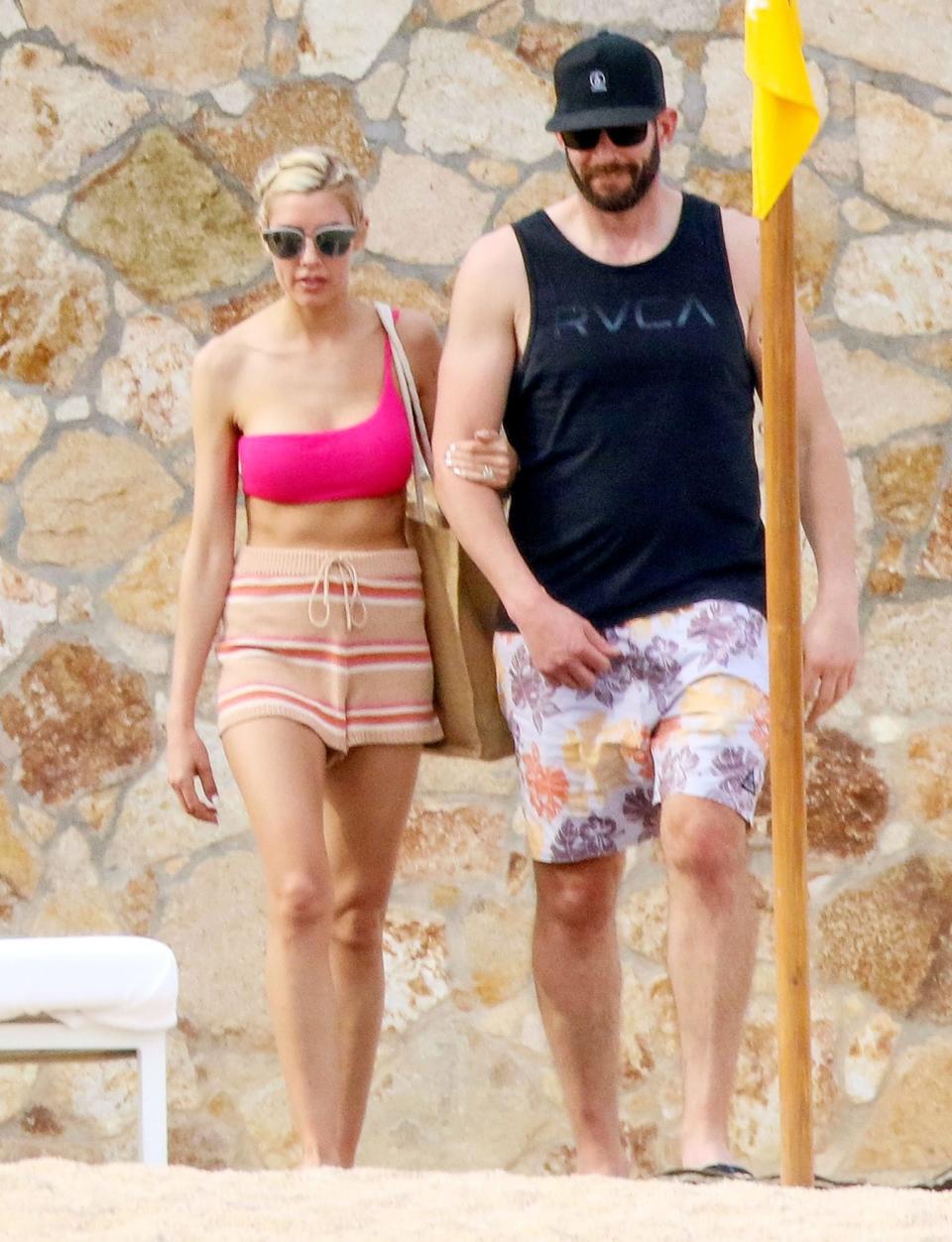 <p>Tarek El Moussa and Heather Rae Young soak up some sun in Cabo San Lucas, Mexico on Sunday.</p>