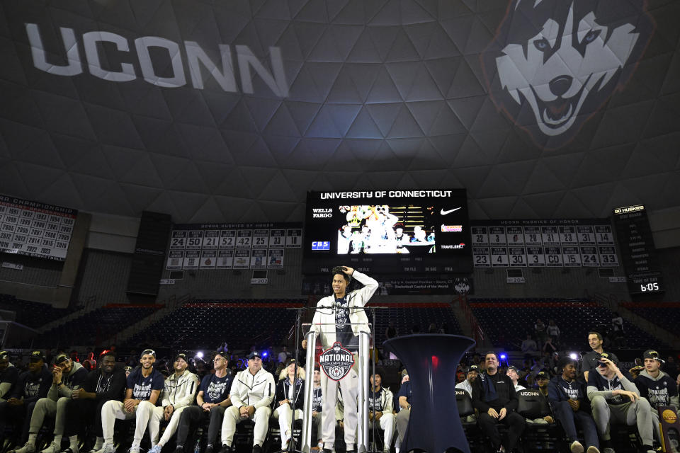 UConn's Jordan Hawkins addresses fans during a rally at Gampel Pavilion in honor of UConn's NCAA men's Division I basketball championship, Tuesday, April 4, 2023, in Storrs, Conn. (AP Photo/Jessica Hill)