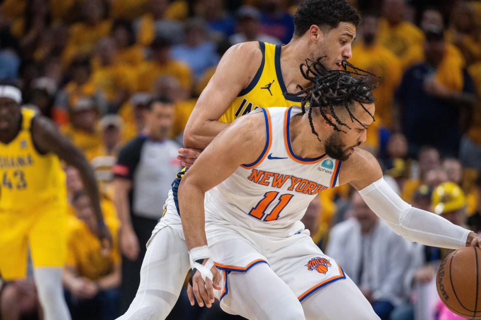 May 17, 2024; Indianapolis, Indiana, USA; New York Knicks guard Jalen Brunson (11) dribbles the ball while Indiana Pacers guard Tyrese Haliburton (0) defends during game six of the second round for the 2024 NBA playoffs at Gainbridge Fieldhouse. Mandatory Credit: Trevor Ruszkowski-USA TODAY Sports