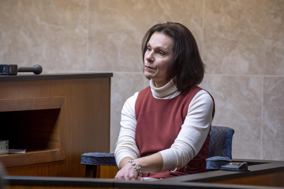 Heather Calcaterra, manager of Oakland County Children's Village, is questioned from the witness stand during a placement hearing for Ethan Crumbley at Oakland County circuit court in Pontiac, Mich., on Tuesday, Feb. 22, 2022, over the teen's placement as he awaits trial. Crumbley, 15, is charged with the fatal shooting of four fellow students and the wounding of seven others, including a teacher at Oxford High School on Nov. 30. (David Guralnick/Detroit News via AP, Pool)