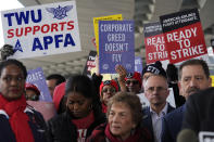 Flight attendants and supporters protest at O'Hare International Airport in Chicago, Tuesday, Feb. 13, 2024. Three separate unions representing flight attendants at major U.S. airlines are picketing and holding rallies at 30 airports on Tuesday as they push for new contracts and higher wages. (AP Photo/Nam Y. Huh)