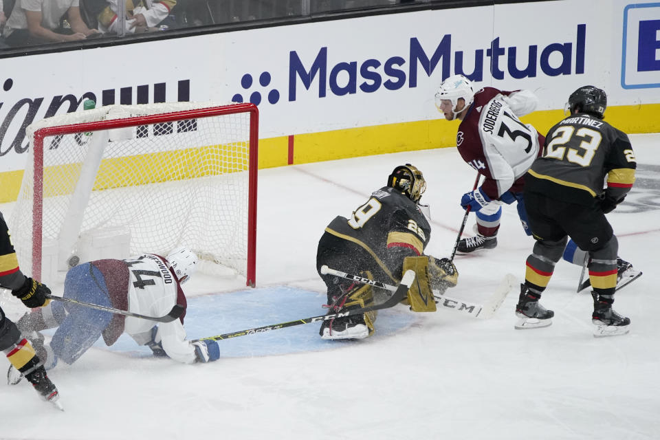 Colorado Avalanche center Carl Soderberg (34) scores a goal against Vegas Golden Knights goaltender Marc-Andre Fleury (29) during the second period in Game 3 of an NHL hockey Stanley Cup second-round playoff series Friday, June 4, 2021, in Las Vegas. (AP Photo/John Locher)