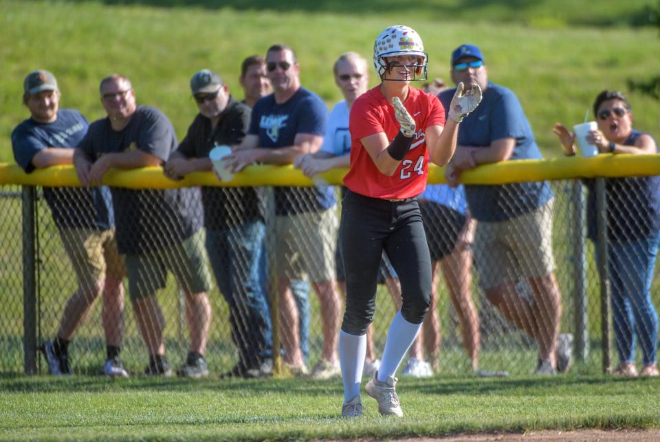 Metamora's Katy Ramage claps after making it to first base on an error late in the Class 3A softball supersectional Monday, June 5, 2023 at EastSide Centre in East Peoria. The Redbirds fell to Lemont 6-0.