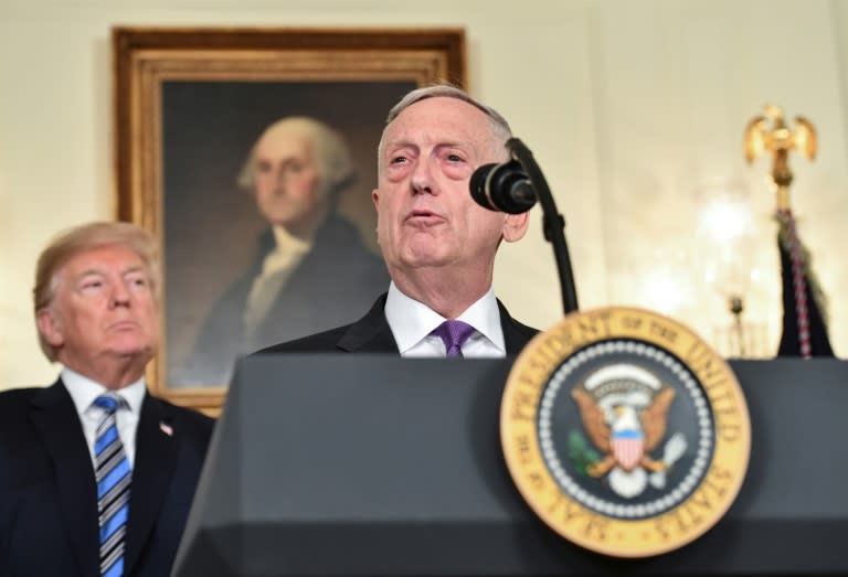 A report from the Defense Department, which is headed by James Mattis (C), laid out details of the restrictions on transgender people serving in the US military