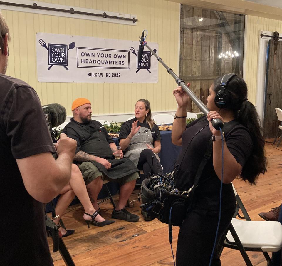 Chefs Karoline Schwartz (right) and Vincent Mangual (left) are being interviewed for a possible reality show for the Own Your Own competition to own their own restaurant in Pender County. Schwartz was named the winner of the competition.