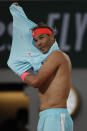 Spain's Rafael Nadal changes shirts in the first round match of the French Open tennis tournament against Egor Gerasimov of Belarus at the Roland Garros stadium in Paris, France, Monday, Sept. 28, 2020. (AP Photo/Alessandra Tarantino)