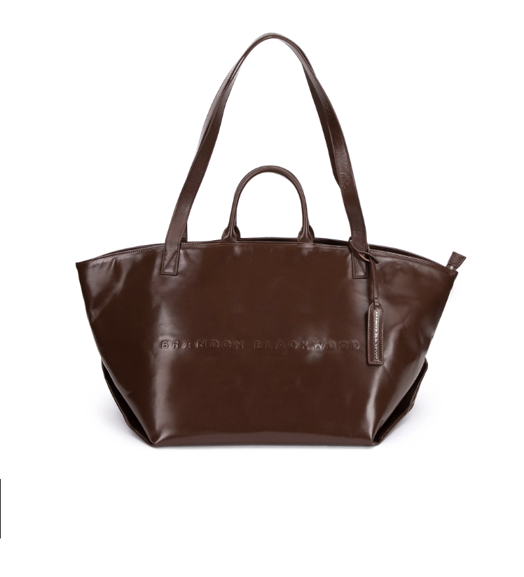 <p><a href="https://brandonblackwood.com/products/everyday-tote-dark-brown-vegetable-tanned-leather-silver" rel="nofollow noopener" target="_blank" data-ylk="slk:Shop Now;elm:context_link;itc:0;sec:content-canvas" class="link rapid-noclick-resp">Shop Now</a></p><p>Everyday Tote</p><p>$485.00</p>