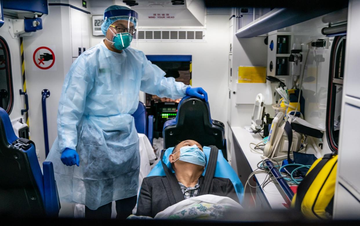 A patient is transferred by an ambulance in Hong Kong - Getty Images AsiaPac