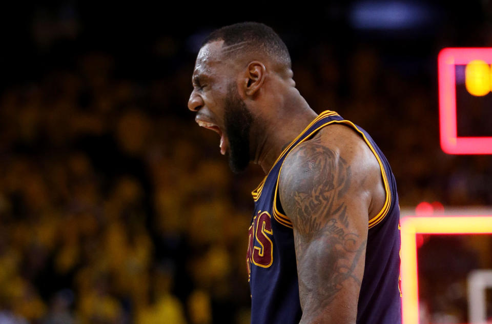 OAKLAND, CA - JUNE 07:  LeBron James #23 of the Cleveland Cavaliers celebrates their 95 to 93 win over the Golden State Warriors in overtime  during Game Two of the 2015 NBA Finals at ORACLE Arena on June 7, 2015 in Oakland, California. NOTE TO USER: User expressly acknowledges and agrees that, by downloading and or using this photograph, user is consenting to the terms and conditions of Getty Images License Agreement.  (Photo by Ezra Shaw/Getty Images)