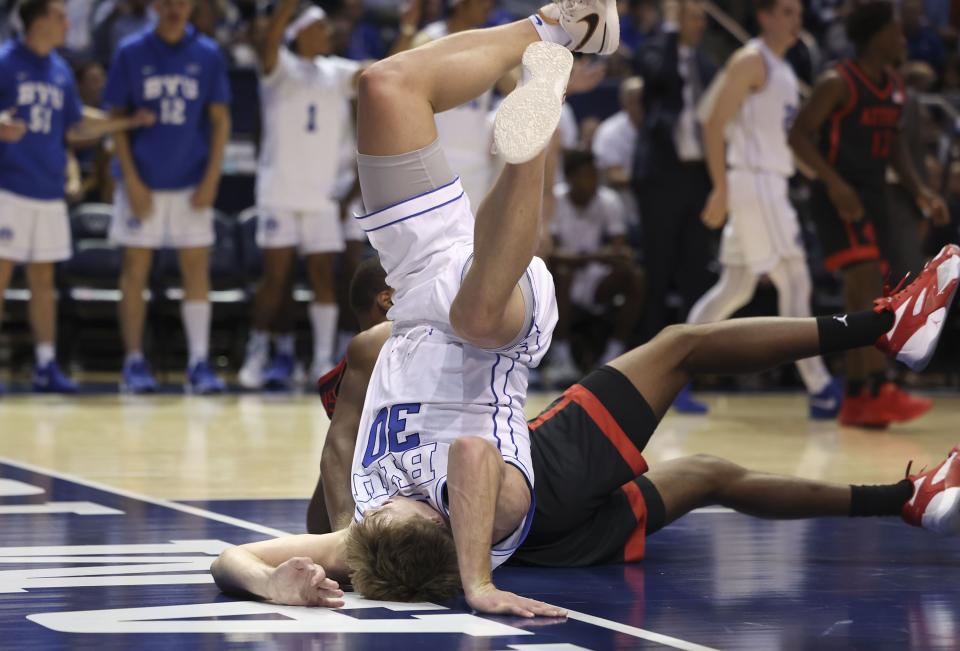Brigham Young Cougars guard Dallin Hall (30) and San Diego State Aztecs guard Micah Parrish (3) collide during the game at BYU’s Marriott Center in Provo on Friday, Nov. 10, 2023. | Laura Seitz, Deseret News