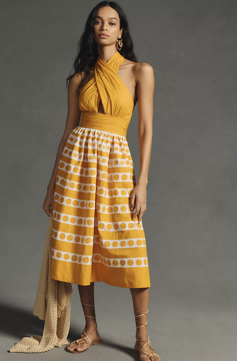  model with long black hair wearing yellow printed Maeve A-Line Halter Dress (photo via Anthropologie)