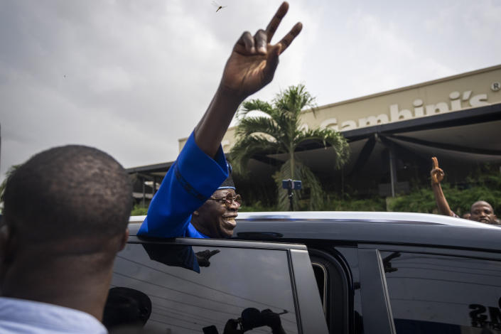 FILE - Presidential candidate Bola Tinubu of the All Progressives Congress gestures to supporters after casting his vote in the presidential elections in Lagos, Nigeria, Feb. 25, 2023. Election officials declared ruling party candidate Bola Tinubu the winner of Nigeria's presidential election early Wednesday, March 1, 2023, with the two leading opposition candidates already demanding a revote in Africa's most populous nation. (AP Photo/Ben Curtis, File)